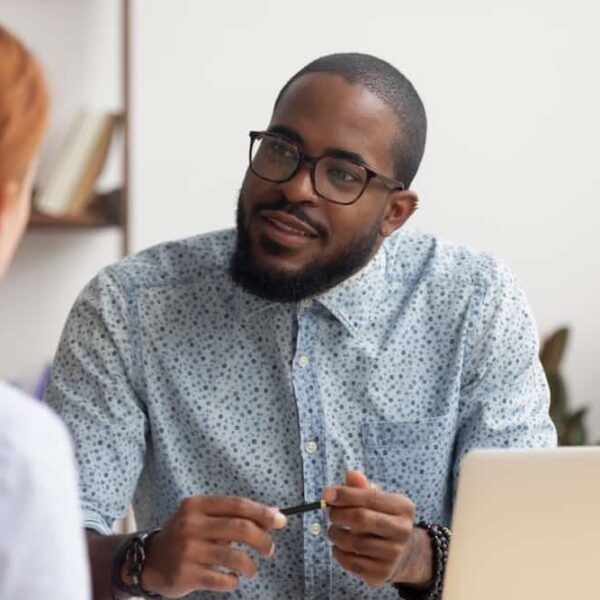 man talking to colleague