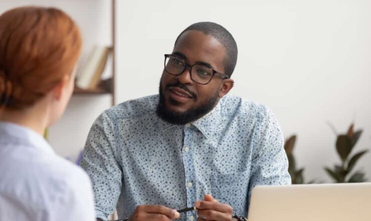 man talking to colleague