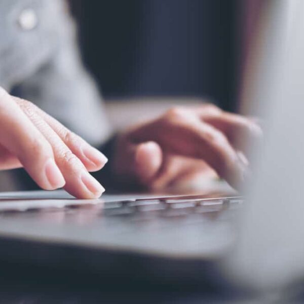 person typing on computer