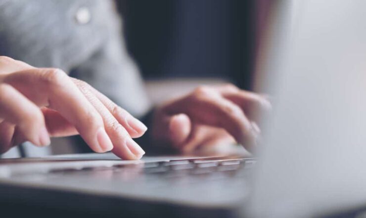 person typing on computer